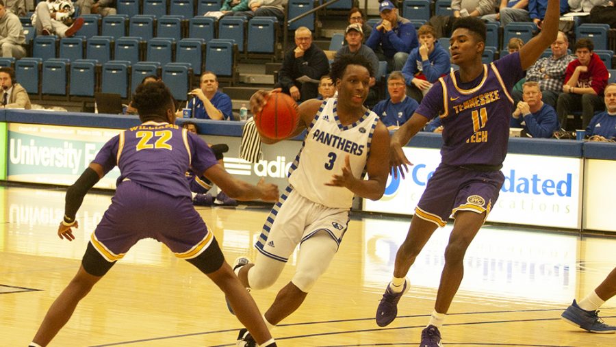 Junior guard Mack Smith drives past two defenders to the rim in Eastern’s 84-59 win against Tennesse Tech on Jan. 18 at Lantz Arena.
