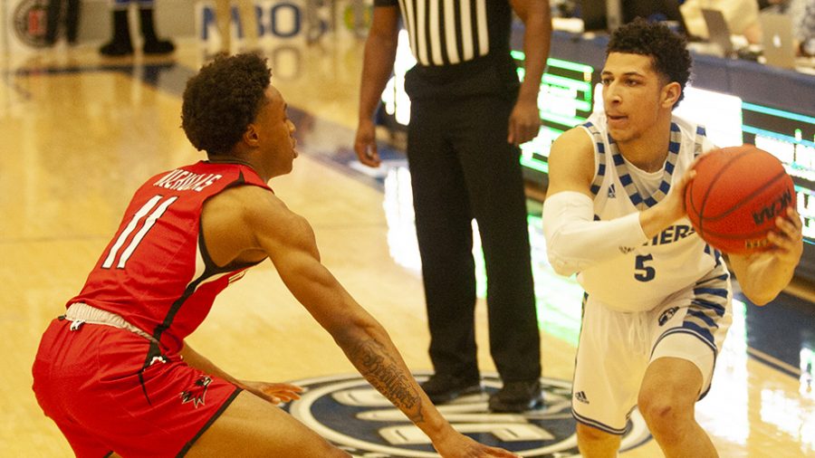 Adam Tumino | The Daily Eastern News
Shareef Smith looks around his defender to try and get a pass attempt off. Eastern defeated Southeast Missouri 61-59 Jan. 25 in Lantz Arena.