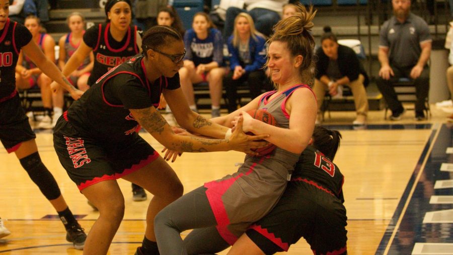 Eastern forward Abby Wahl fights for a ball in the Panthers 77-65 loss to Southeast Missouri Saturday in Lantz Arena. 