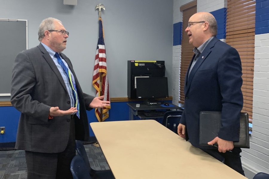 Philip Peña (left), a candidate for the Vice President of Business Affairs, and Mark Hudson (right), director of Housing and Dining, talk after the open session for the Vice President of Business Affairs search Wednesday afternoon.