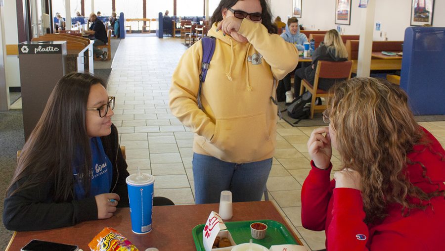 Luz Stanislawek (left), freshman pre physical therapy major, Brianna King (middle), a freshman criminology major, and Margaret McNellis, a freshman special education major, enjoy lunch together on Thursday afternoon at the Food Court in the Martin Luther King Jr. University Union. King decided to stop by at the lunch table after seeing Stanislawek and McNellis eating lunch.
