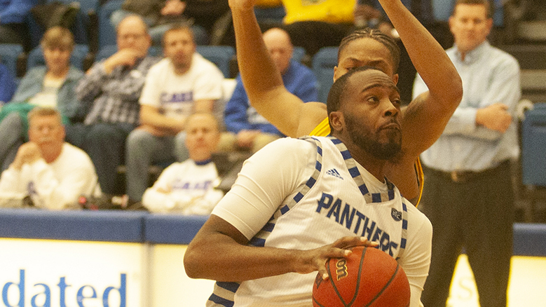 Adam Tumino | The Daily Eastern News
JaQualis Matlock plays through contact from his defender to drive down the lane for a layup attempt. Eastern defeated Morehead State 71-65 Feb. 6 in Lantz Arena.