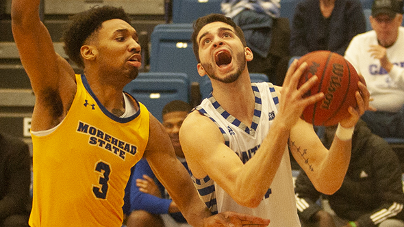 Eastern guard Josiah Wallace drives around a Morehead State defender on Feb. 8 in Lantz Arena. Wallace had 25 points in a 71-65 win.