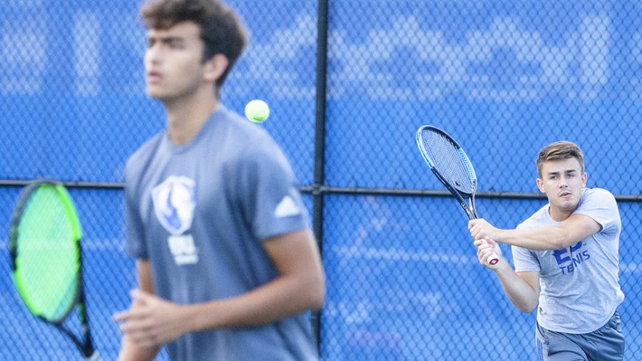 Eastern senior Gertjan De Wilder attempts a backhand shot in the Eastern Illinois Fall Invite last September at the Darling Courts during a doubles match. The men’s tennis team plays at Green Bay Saturday at 9 p.m.