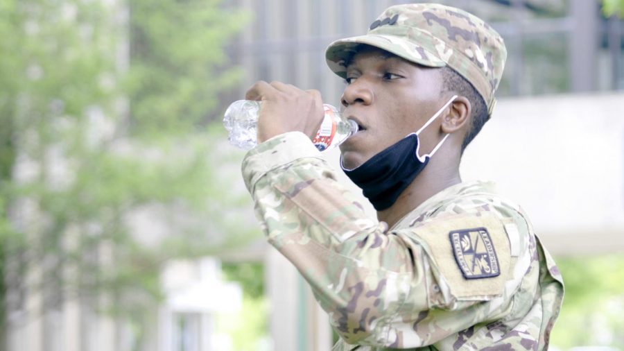 Sodiq Amuda, a construction management senior takes a sip of water Thursday afternoon. Amuda, part of the ROTC program had a chance to grab a water break during ROTC training.