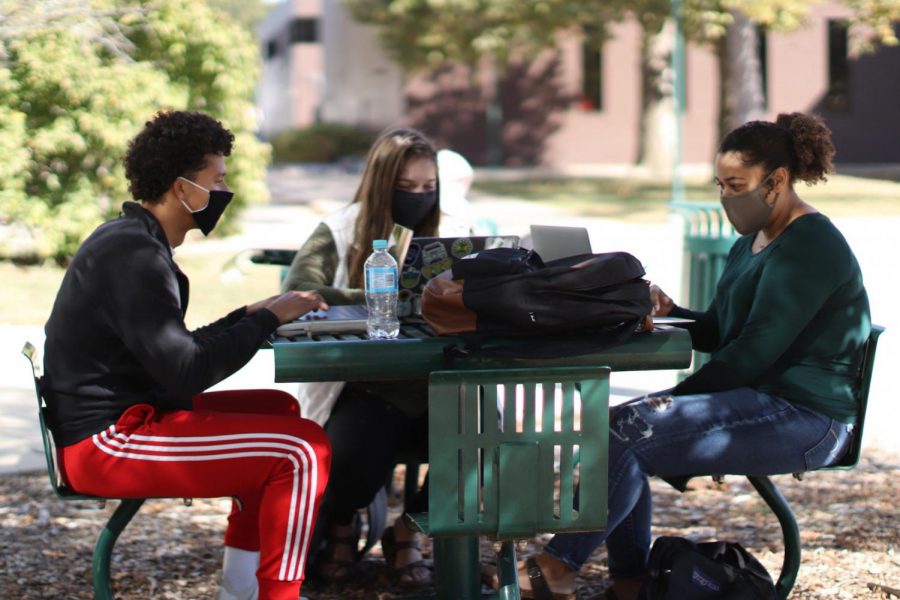 Josiah Wright (left), a junior mathematics education major, Emily Weber (middle), a sophomore mathematics education major, and Mattie Land, a sophomore family and consumer science major, study in the library quad. The group commented that they were “studying and trying to stay safe for midterms.”