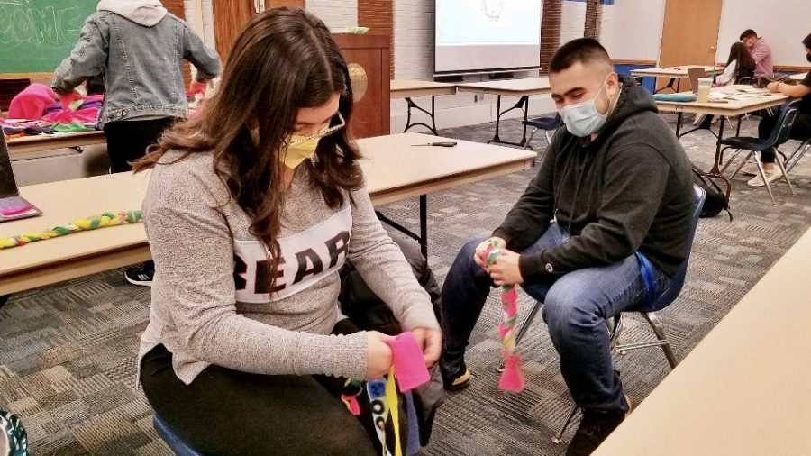 Kristal Muñoz and Angel Enriquez make dog toys during LASO Volunteer Event on Feb. 26, 2021 at the Martin Luther King Jr. University Union. Every year LASO has a volunteer event where they make dog toys for “pups in need” and write letters to future Latinx Panthers. 