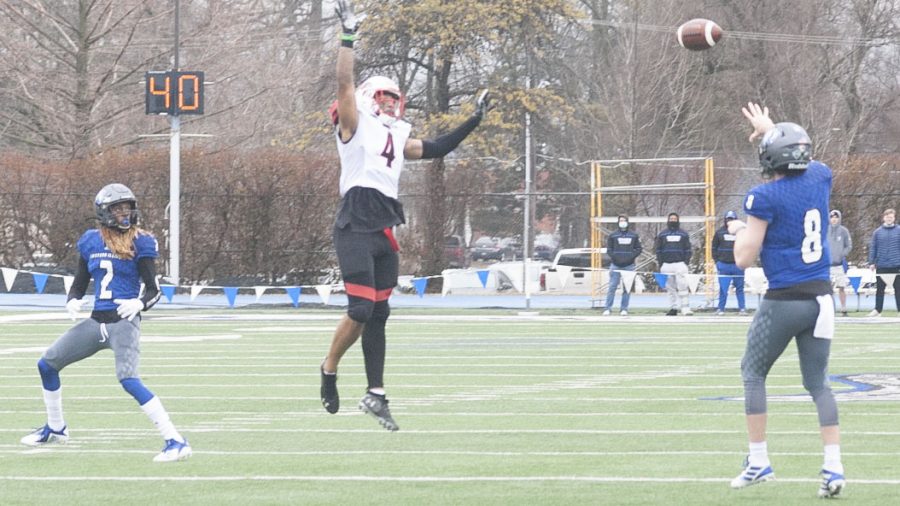 Eastern quarterback Harry Woodbery attempts to lob a pass over a leaping defender to wide receiver DeWayne Cooks Jr. in the Panthers 47-7 loss against Southeast Missouri Feb. 28. Cooks had 5 catches for 62 yards in the game. 