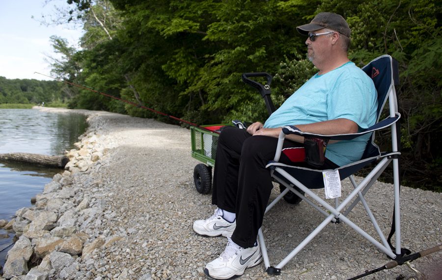 Tim Quick, a resident of Charleston, fishes for catfish at Lake Charleston. He said hes only caught a few small crappies for the day. Quick added that he saw a few catfish swimming close to the shore yesterday eating on the cotton wood, teasing him. 