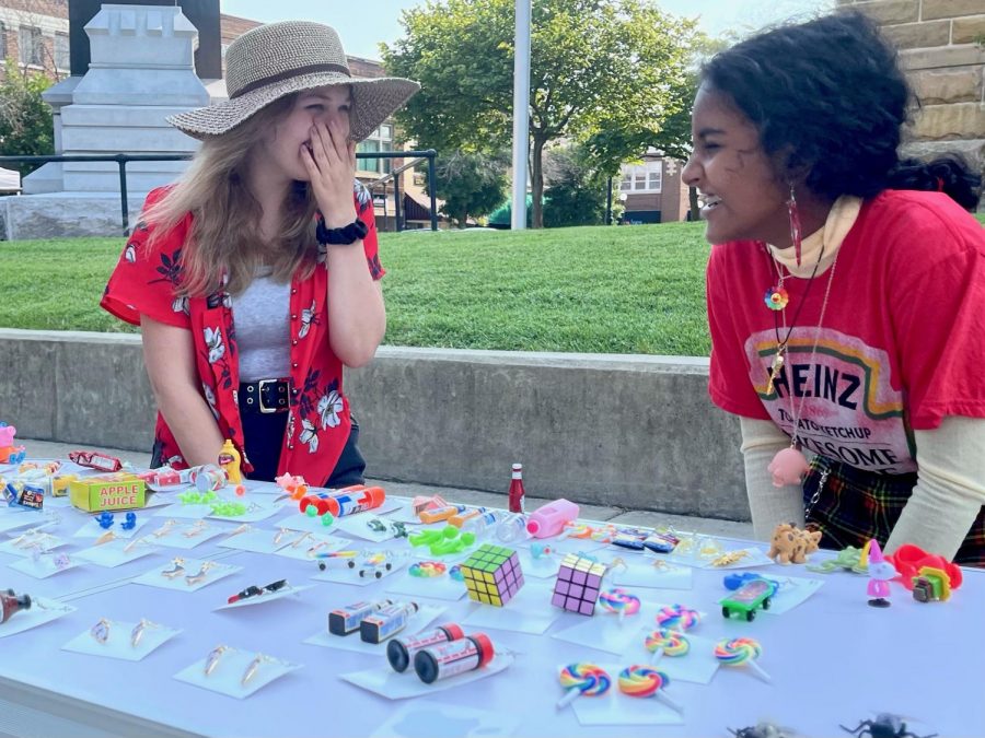 Charleston residents Elaina Sutula and Nethmi Periyannan sell earrings at the Coles County Courthouse. The earrings were made of toys, office supplies and miniatures.