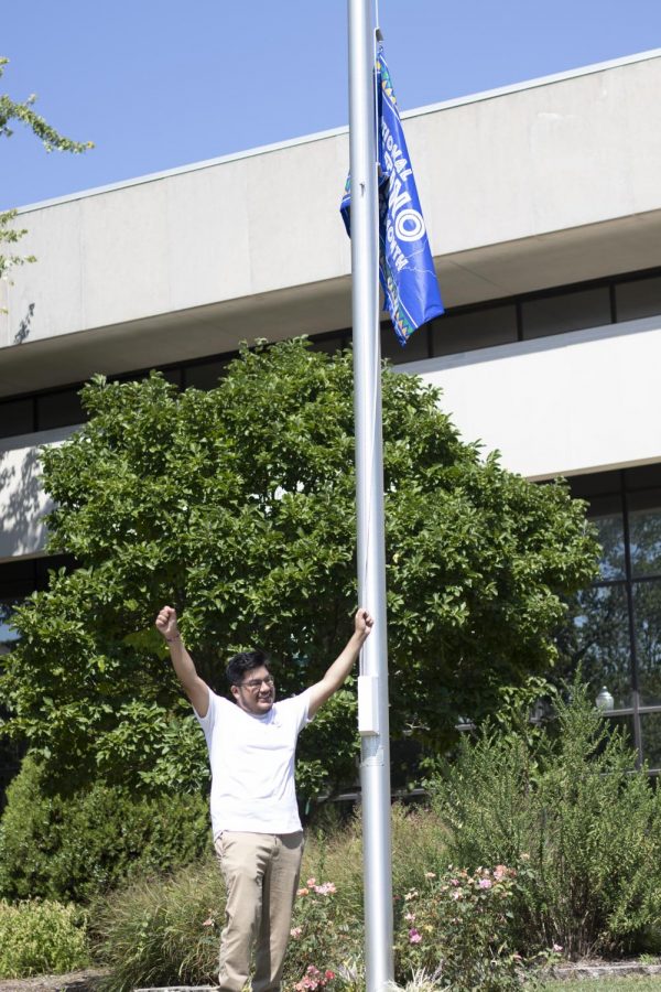 Luis Paniagua, a senior graphic design major, and the recruitment chair and secretary for Alpha Psi Lambda, shows his excitement after raising the Latino Heritage Flag.