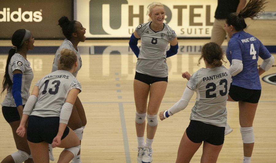 The+Eastern+volleyball+team+celebrates+a+service+ace+from+junior+setter+Summer+Smith+%288%29+in+the+Panthers+3-1+win+over+Northern+Illinois+Thursday+in+Lantz+Arena.+Smith+has+2+aces+and+season+high+30+assists+in+the+match.+