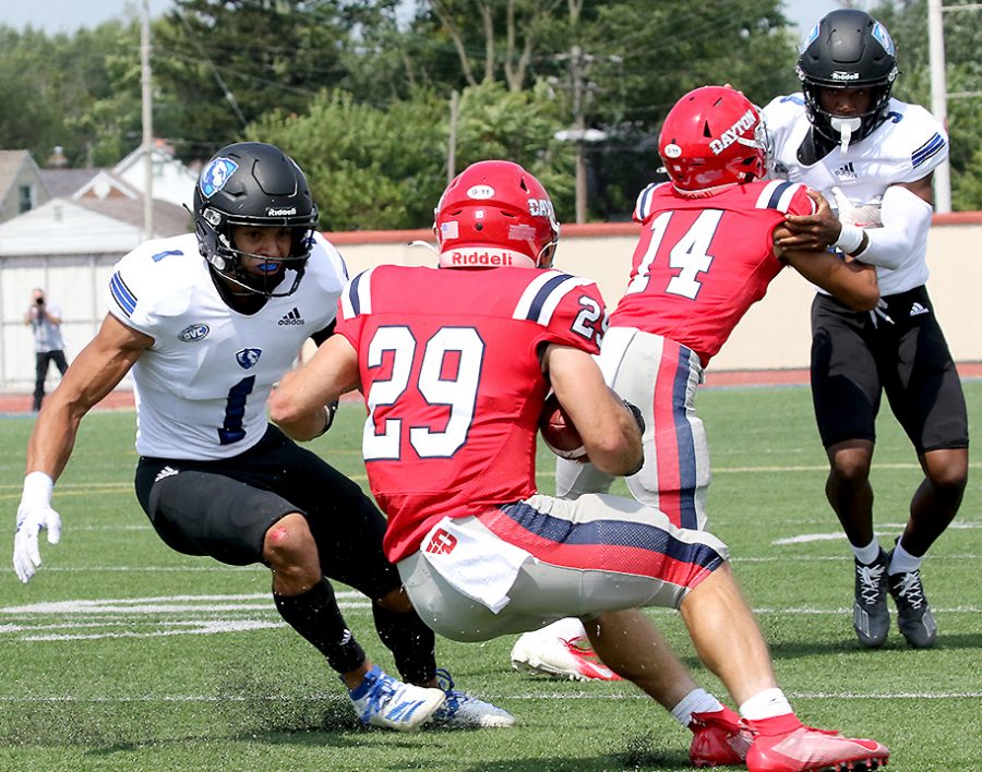 Eastern safety Jordan Vincent (1) prepares to make attempt a tackle on a Dayton ball carrier in a game on Sept. 11. Vincent had 12 total tackles in the game, which Eastern lost 17-10. 