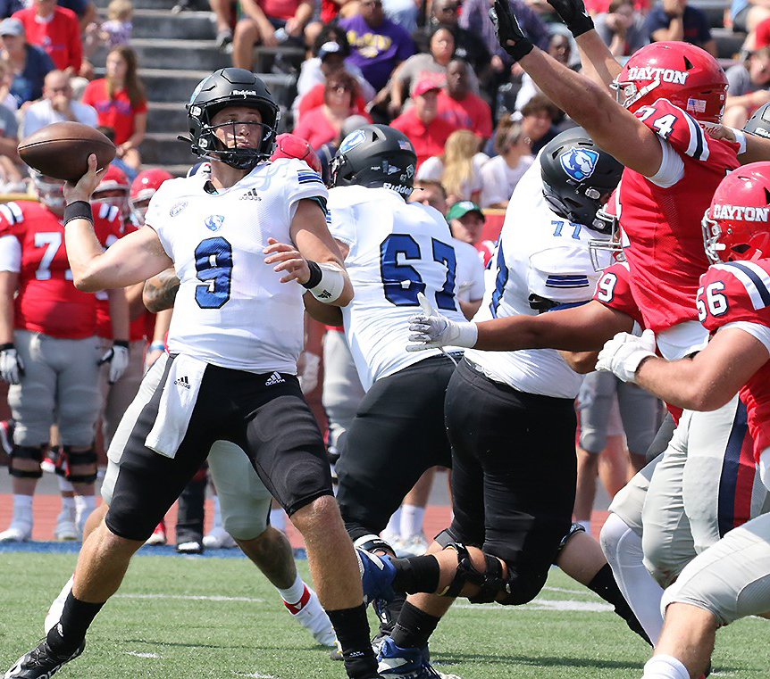 Eastern quarterback Chris Katrenick releases a pass while the Dayton pass rush bears down on him in a game Sept. 11. Katrenick was 12-for-27 passing for 111 yards in the game, which Eastern lost 17-10. 