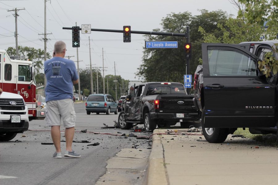 Scott Smith, Charleston, Ill. city manager observes the damages of the five-car accident on the intersection of University Drive and Lincoln Ave on Sept. 19, 2021. 