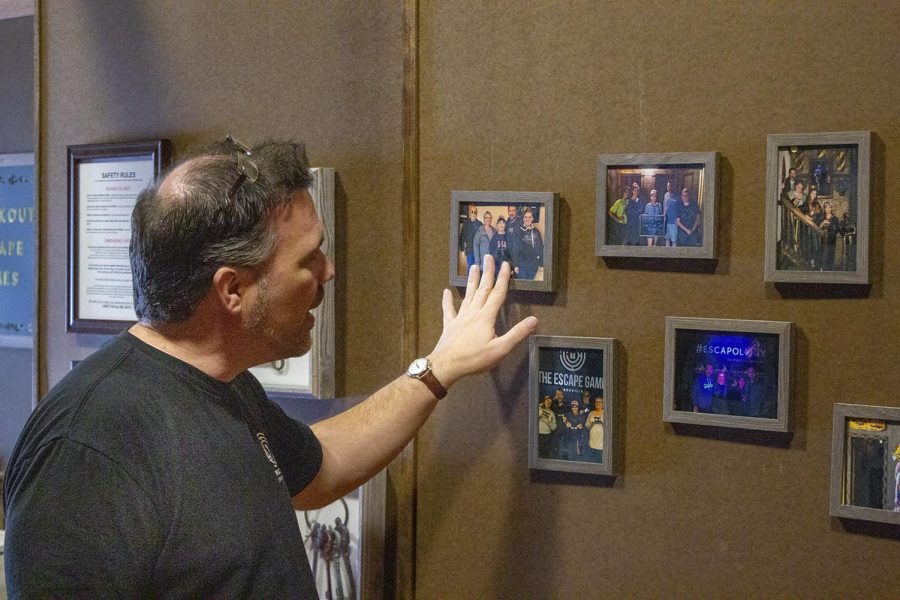 Doug West, owner of Breakout Escape Games has photos of other escape rooms he has particpated in on display at his escape room. 