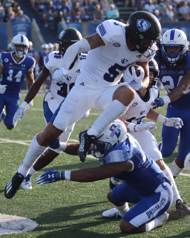 Ashanti Thomas | The Daily Eastern News
Eastern wide receiver Matt Judd attempts to hurdle a tackler during a kick return against Indiana State on Aug. 28 in Terre Haute. Judd returned two kickoffs in the game for 33 yards and a long of 20 yards. Eastern lost the game 26-21.
