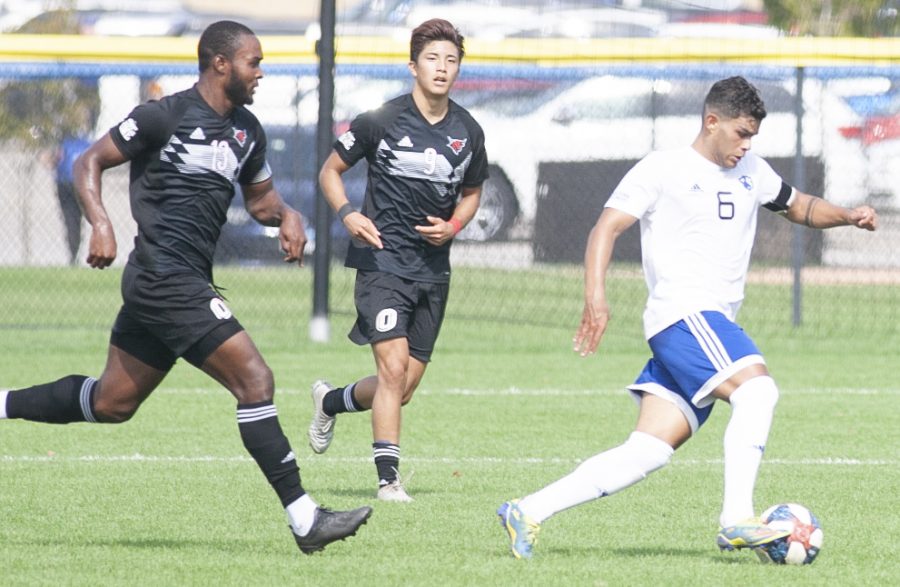 Eastern midfielder Jonas Castelhano dribbles away from a pair of opponents in a match against Omaha on Oct. 9 at Lakeside Field. Castelhano had an assist in the match, a 2-1 loss for Eastern. 