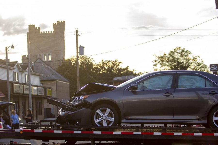 One of the cars involved in the two-car accident at Lincoln Avenue and Ninth Street sits on the back of the tow truck Monday evening. 