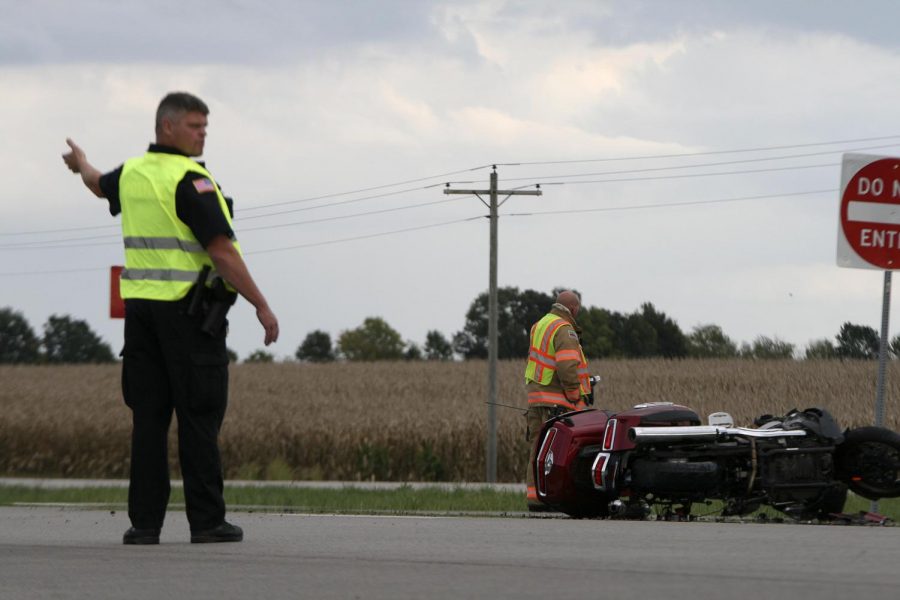 Members of the Charleston Police and Fire Departments assist at the two-vehicle crash on Route 16 and Deerpass Road Monday evening.