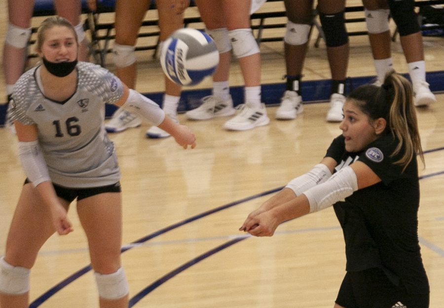 Eastern libero Christina Martinez Mundo (right) receives a serve in a match against Southern Illinois-Edwardsville on Oct. 5 in Lantz Arena. Martinez Mundo had a game-high 19 digs in the match, which Eastern lost 3-1. 