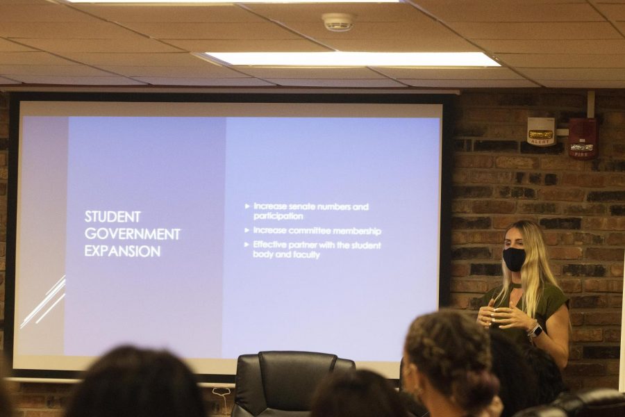 Katelynn Alexander, a senior political science major and student senator, presents her powerpoint presentation during the Student Government meeting Wednesday night.