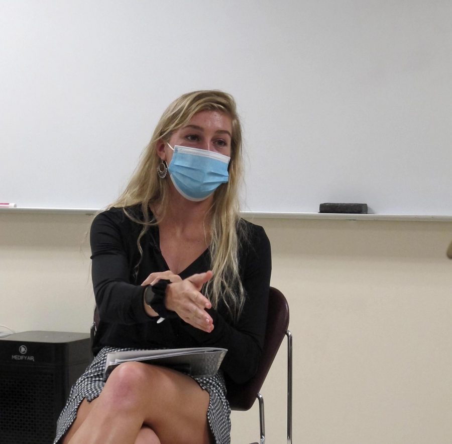 Lindsey Carlson, a grauduate assistant at th Health Education Resource Center, partipates in a group discussion about the upcoming Flu Clinic in a Writing for News Media class.