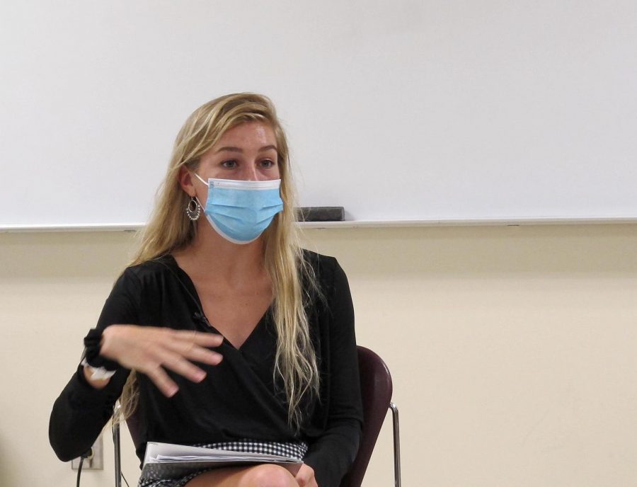 Lindsey Carlson, a graduate assistant at the Health Education Resource Center, participates in a group discussion about the upcoming Flu Clinic in a Writing for News Media class.