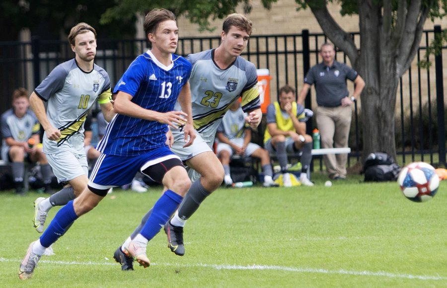 Eastern midfielder Chad Hamler tries to beat two opponents to the ball in Easterns match against Purdue Fort Wayne on Sept. 3 at Lakeside Field. Eastern lost the match 1-0. 