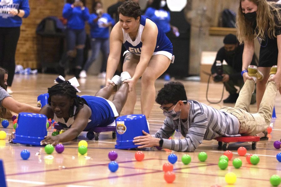 During the 2-21 homecoming pep rally on Oct. 24, students play a game of hungry hippo. Teams have to work together to gather as many balls as they can before the music stops.