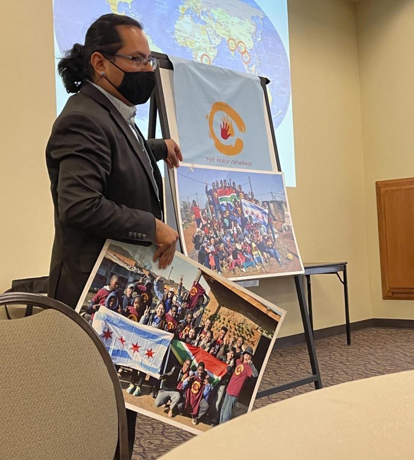Henry Cervantes, program manager at The Peace Exchange, gives a presentation on nonviolence and social change at the Charleston Carnegie Library, Friday afternoon. 