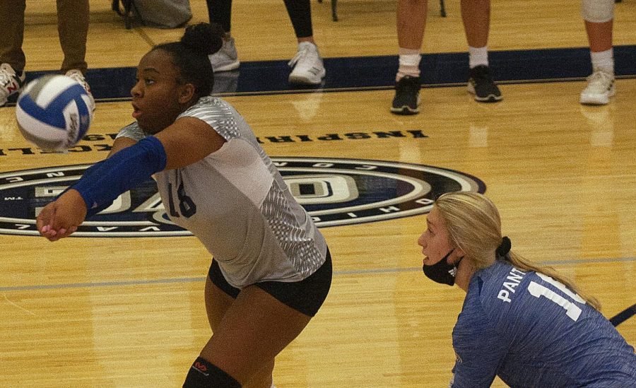 Eastern freshman outside hitter TaKenya Stafford (left) receives a serve in a match against Morehead State on Oct. 22 in Lantz Arena. Stafford had 6 kills in the match, a 3-0 loss for Eastern. 