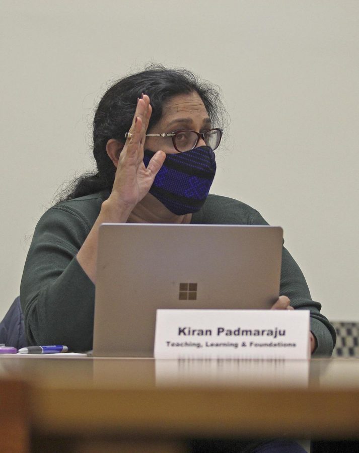 Council of Academic Affairs member Kiran Padmaraju motions in favor of adding an item to the agenda at the Oct. 28 meeting. The council voted on a proposed departmental honors program for the Department of Human Services and Community Leadership with all present members approving. 