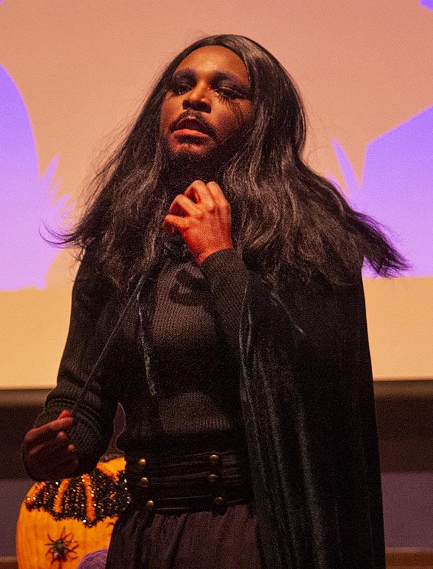 Nezha sings “Everybody Dies” by Kim Petras at the Martin Luther King Jr. Grand Ballroom stage at the Saturday night drag show. “I think [the audience] loved it because I think I was the only one who really went there with a whle Halloween spooky thing, especially with the blood,” Nezha said.