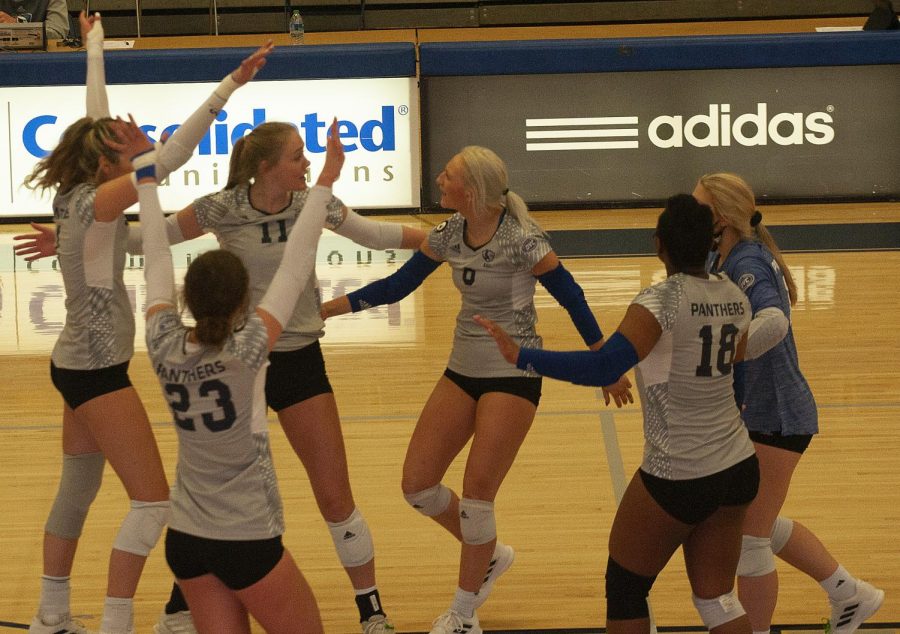 Members+of+the+Eastern+volleyball+team+celebrate+a+point+in+a+match+against+Morehead+State+on+Oct.+22+in+Lantz+Arena.+The+Panthers+lost+the+match+3-0+to+the+Eagles.+
