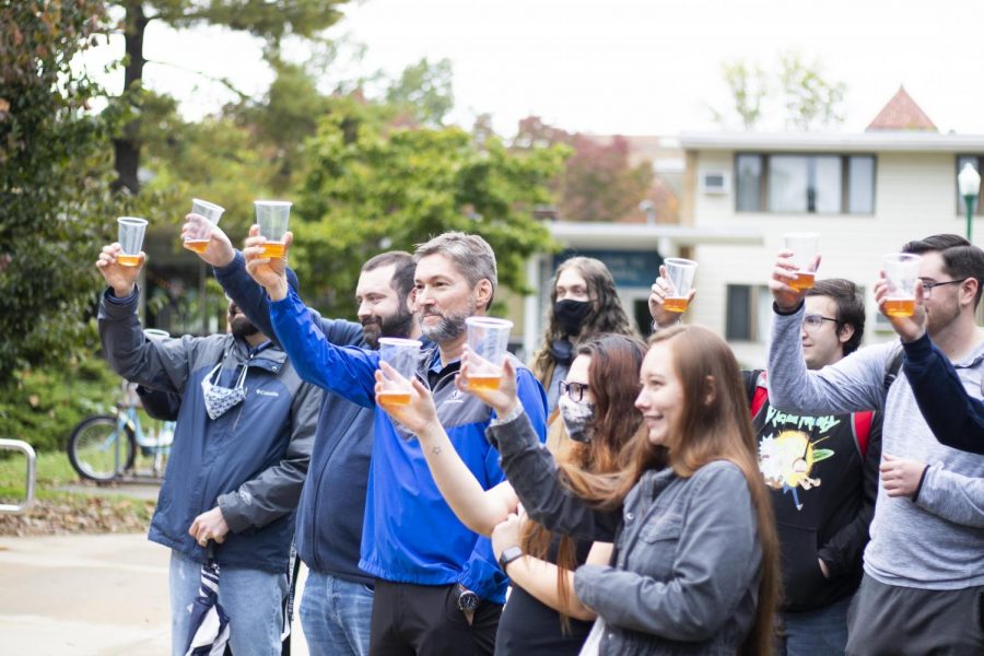 The crowd toasts to the Doug DiBianco floor dedication in front of McKinney Hall Friday afternoon. 