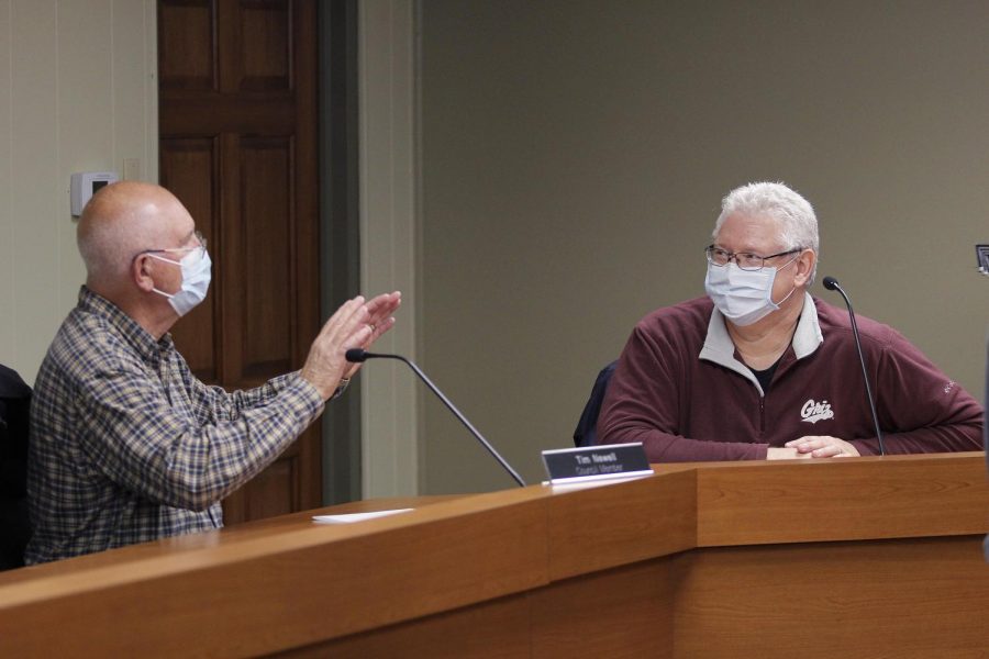 Charleston City Council Members Tim Newell and Jeff Lahr converse at the end of the Nov. 2 City Council meeting. During the meeting, the council voted on awarding a bid to R&R Services, Inc. from Argenta, Ill., to perform landscape waste tub grinding for the city. The total cost is $45,000 and the funds for the project have already been counted for in Charleston’s FY22 budget.