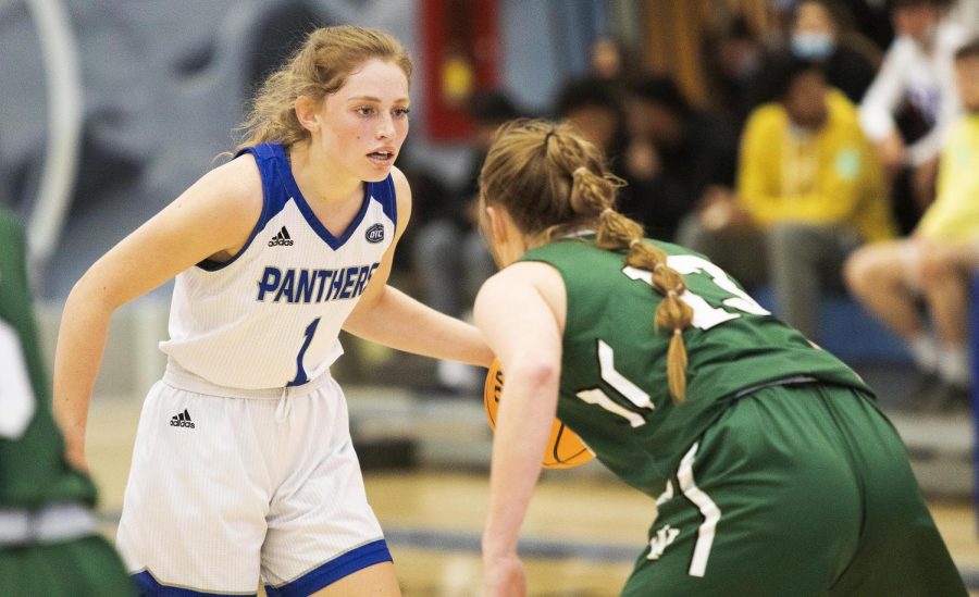 Kira+Arthofer%2C+a+senior+guard%2C+faces+an+Illinois+Wesleyan+player+during+an+exhibition+on+Nov.+3+in+Lantz+Arena.+Arthofer+scored+a+total+of+16+points.+The+Panthers+won+83-54+against+the+Titans.+