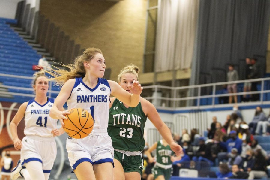 Kira Arthofer, a senior guard, pushes the ball towards the basket at the Wednesday night women’s basketball game in Lantz Arena. Arthofer scored a total of 16 points. The Panthers won 83-54 against the Titans.