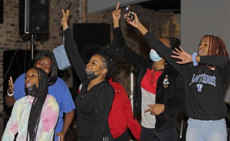 Members from Team 2 from the Battle of The Aux, hosted by the Black Student Union, sing and dance to “The Climb” by Miley Cyrus on Monday night in 7th Street Underground in the Martin Luther King Jr. Union. The teams competed in genres including: country, hip-hop rap, gospel, rock, and reggae.