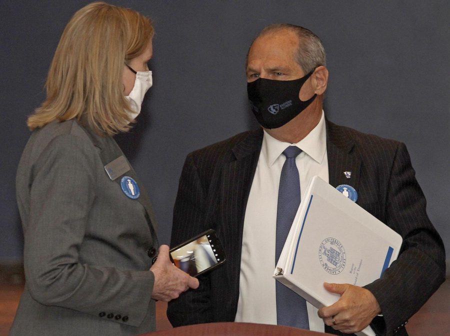 Joyce Madigan, the chairperson for the Board of Trustees, and David Glassman, Eastern Illinois University President, convene after the Friday Board of Trustees meeting was adjourned. The meeting was held at the Martin Luther King Jr. Union University Ballroom. The board approved of an additoin of one year to Glassman’s contract, all were in favor of the extension except one.