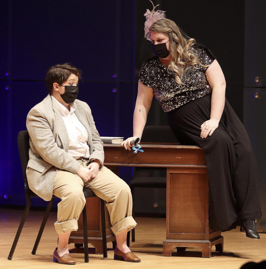 In “The Impresario” by Mozart, Ms. Scruples, the head of the opera, played by Angela Gausmann, a junior vocal performance major, listens to Madame Goldenthrill portrayed by Mikayla Beck, graduate student studying vocal performance, who is trying to appeal to them. The show was performed at the Recital Hall in Doudna Fine Arts Center.