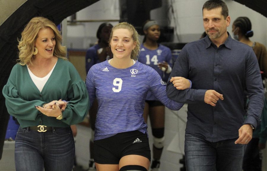 Eastern senior Bailey Chandler walks onto the court with her family during a pregame ceremony Saturday at Lantz Arena. Chandler was one of four seniors honored prior to the Panthers match against Austin Peay. 