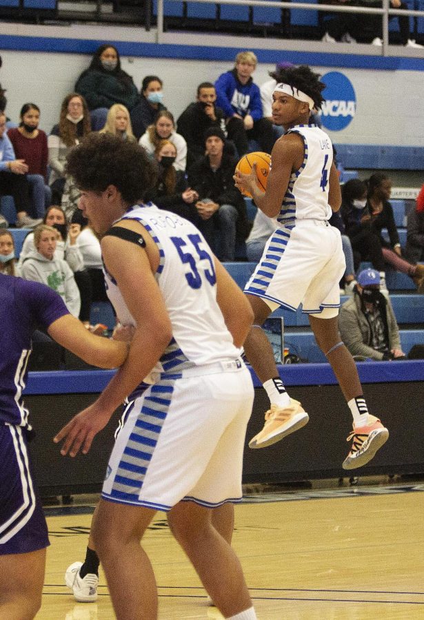 Eastern guard CJ Lane jumps to gather a pass in the Panther’s game against Rockford Thursday in Lantz Arena. Lane had 11 points in the game, which Eastern won 96-64.