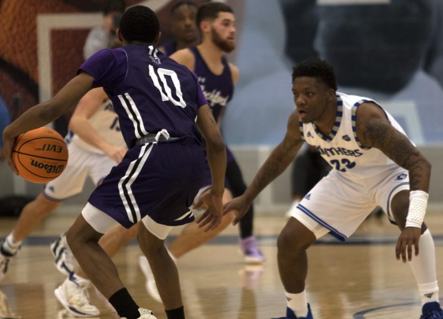 Eastern guard Kejuan Clements (right) guards an opponent in a game against Rockford on Nov. 18 in Lantz Arena. Clements had 12 points and 7 assists in the game, which Eastern won 96-64.  