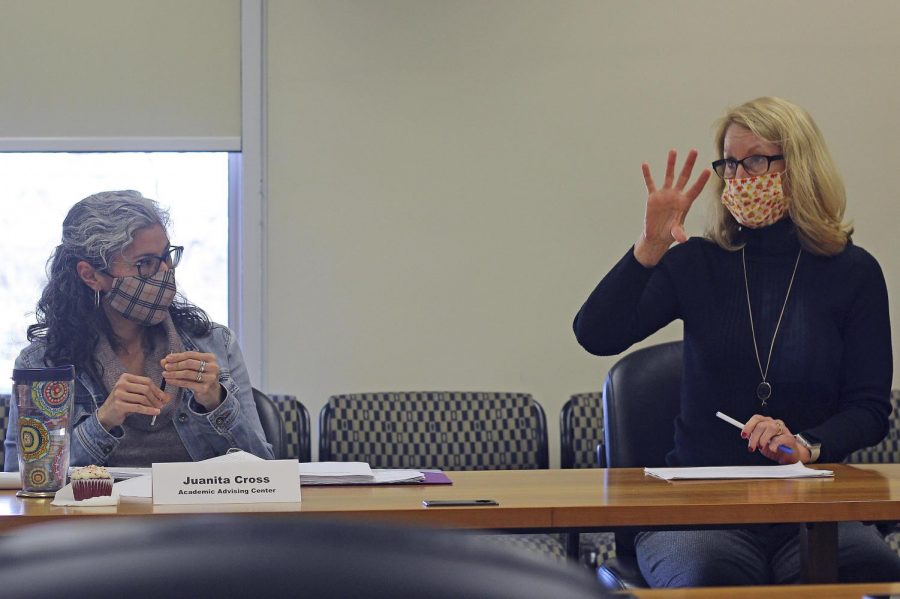 Holly Farley, an associate professor in the nursing program, explains changes to the Issues and Practicum in the Professional Nursing program to council member Juanita Cross at Thursday afternoon CAA meeting. The council unanimously approved of the vote with revision to the format. 