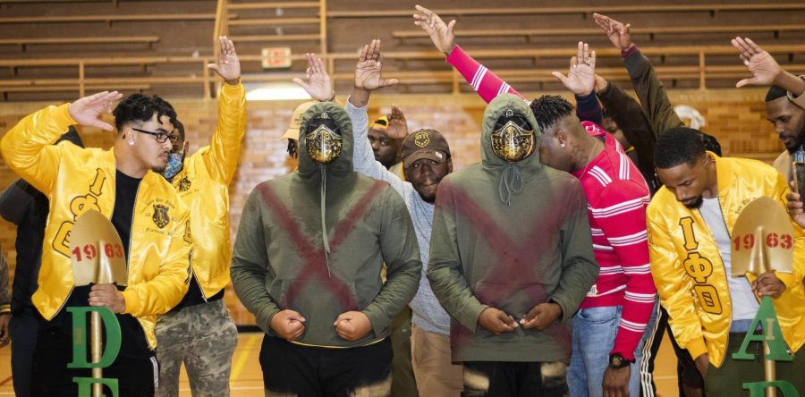 Iota Phi Theta Fraternity Incorporated presents the Neophyte Presentation performed in McAfee Gym Friday night by the newest members of Iota Phi Theta Fraternity Inc., Kris Gross, (center left) a sophomore sport management major, and Leon Lomax, (center right) a junior digital media technology major. The men were represented by the Dean, Ian Davis, (far left) a senior exercise science major, and the ADP, Dj Jones, (far right) a senior digital media and graphic design major.
