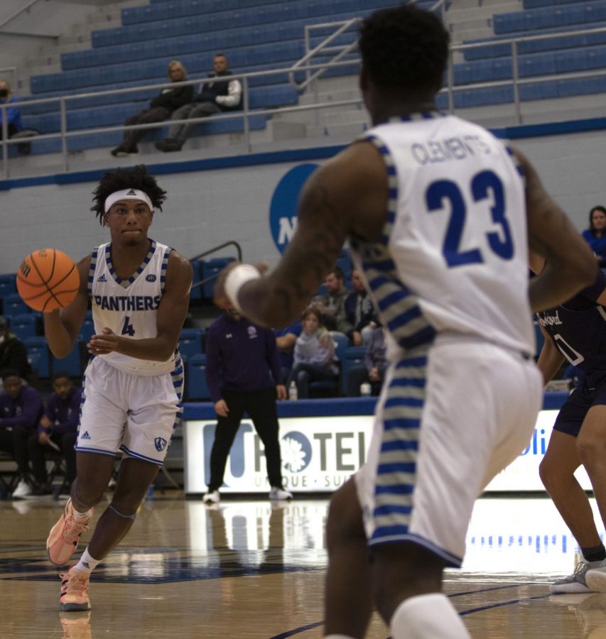 Eastern guard CJ Lane looks to pass to guard Kejuan Clements in Easterns game against Rockford on Nov. 18 in Lantz Arena. Lane had 11 points in the game, which Eastern won 96-64.