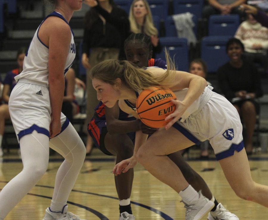 Eastern guard Kira Arthofer attempts to drive by a defender with help from a screen by forward Abby Wahl in Easterns game against Evansville on Nov. 20 in Lantz Arena. Arthofer had 16 points and 4 steals in the game, which Eastern won 85-74 in double overtime. 