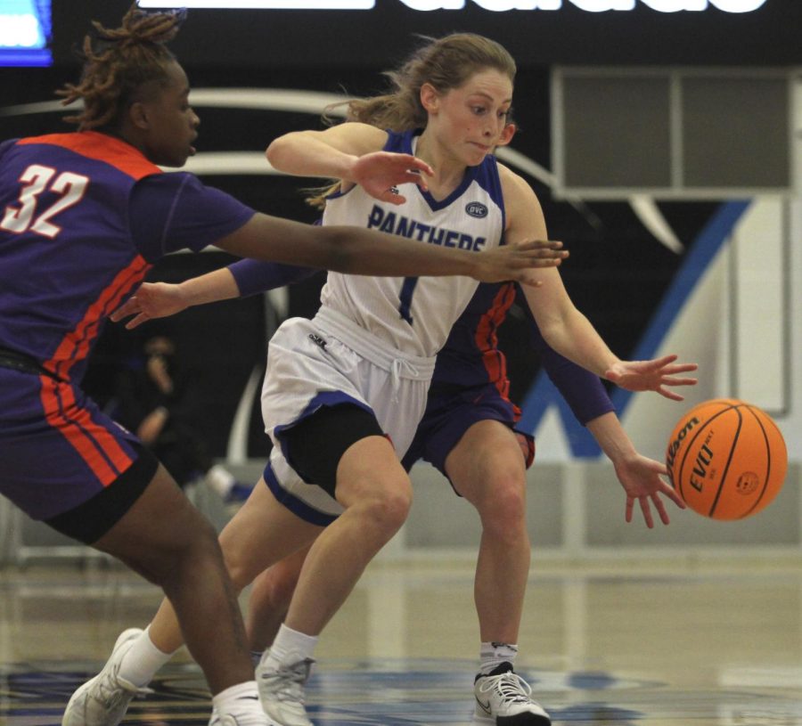 Eastern guard Kira Arthofer dribbles through traffic in Easterns game against Evansville on Nov. 20 in Lantz Arena. Arthofer had 16 points in the game, which Eastern won 85-74 in double overtime. 